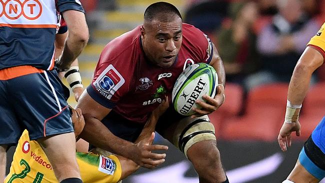 Caleb Timu of the Reds (centre) is tackled during the Round 4 Super Rugby match between the Queensland Reds and the Bulls at Suncorp Stadium in Brisbane, Saturday, March 10, 2018. (AAP Image/Dan Peled) NO ARCHIVING, EDITORIAL USE ONLY