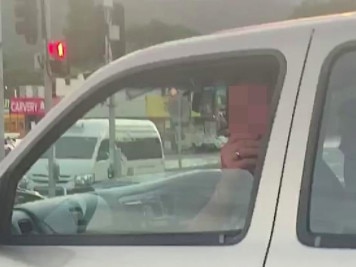 A passenger at a set of traffic lights in Cairns has taunted a South Korean man with fake coughs and sneezes. Picture: Facebook