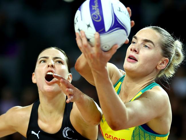 AUCKLAND, NEW ZEALAND - OCTOBER 23: Kiera Austin of Australia takes the pass ahead of Karin Burger of New Zealand during the game two of the Constellation Cup series between New Zealand Silver Ferns and Australia Diamonds at Spark Arena on October 23, 2024 in Auckland, New Zealand. (Photo by Phil Walter/Getty Images)