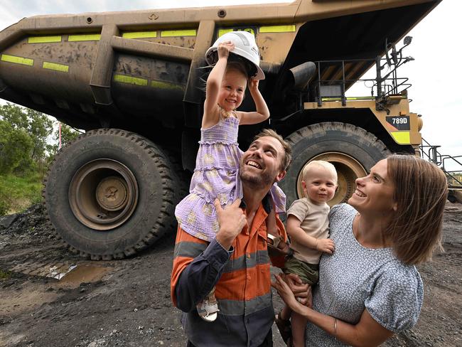 27/10/2022: Newly re hired former New Acland mine worker Bodie Sherrington 33, wife Abby and their children Isla 3 and Monty 1, taking the  rare opportunity to show his family some of the huge machinery while the mine is still shut down, ahead of its full reopening in the near future. Bodie is the mines Technical Services Superintendent , who lost his job when the mine closed, and is the first to be re hired back following the mines approval to operate. pic Lyndon Mechielsen