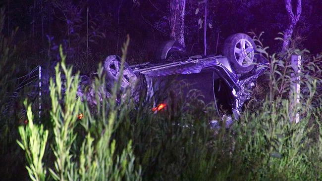 About 7.45pm on Sunday December 9 2018, a vehicle was travelling south on the Pacific Highway, Glenugie, when it left the road, crashed through a fence, and rolled. Two men in the car died at the scene. A female passenger was trapped in the vehicle for a short time before she was released. Photo: Frank Redward.