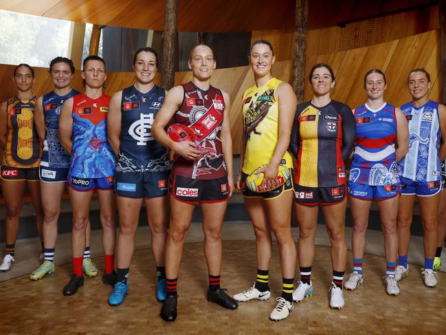 AFLW players model their Indigenous jumpers. Picture: Michael Klein