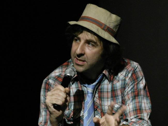 David O'Doherty performing on stage.