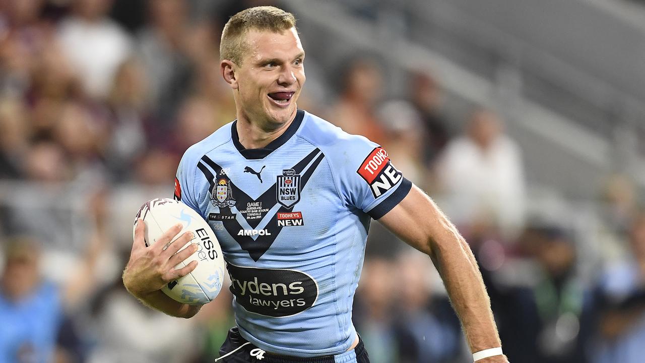 TOWNSVILLE, AUSTRALIA - JUNE 09: Tom Trbojevic of the Blues runs to score a try during game one of the 2021 State of Origin series between the New South Wales Blues and the Queensland Maroons at Queensland Country Bank Stadium on June 09, 2021 in Townsville, Australia. (Photo by Ian Hitchcock/Getty Images)