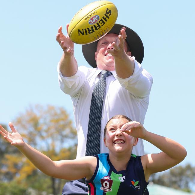 Premier Steven Miles with his daughter Bridie 10 playing AFL at the Maroochydore Multi Sports Complex on the Sunshine Coast. Picture: Adam Head