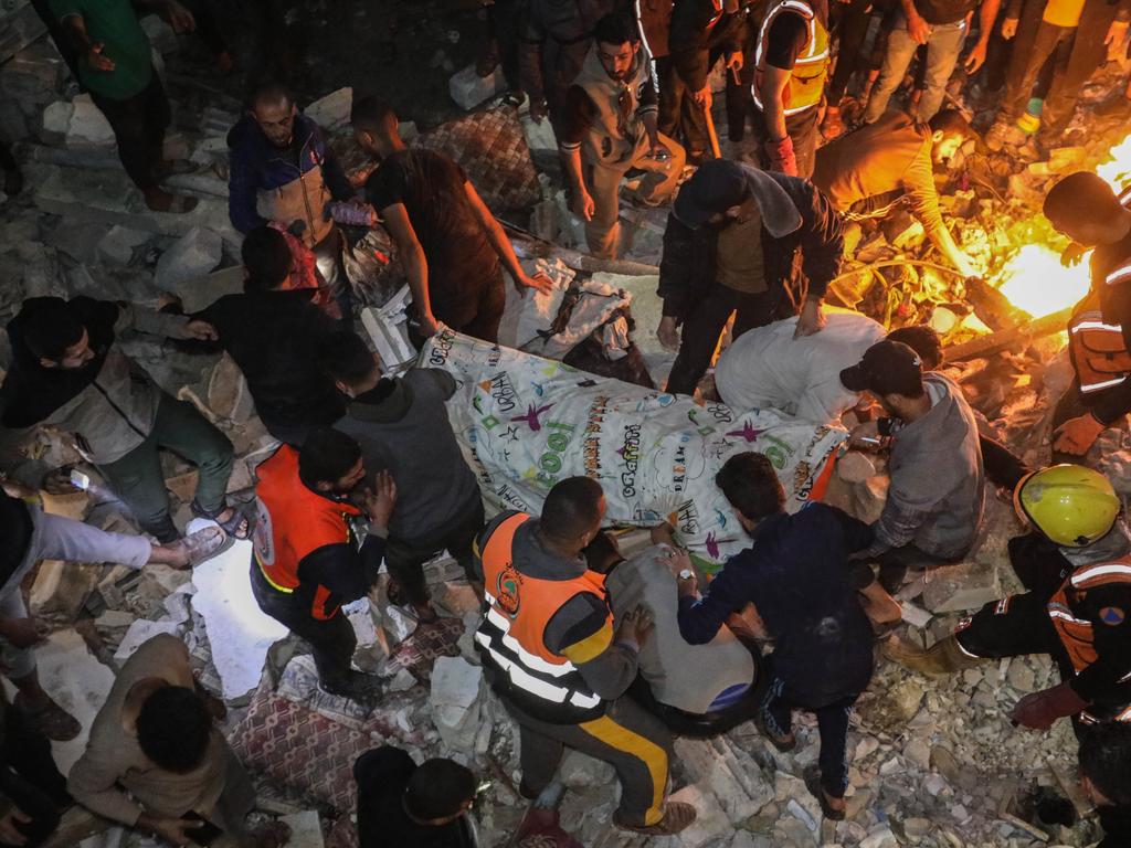 People inspect damage to their homes caused by Israeli air strikes in Rafah, Gaza. Picture: Ahmad Hasaballah/Getty Images