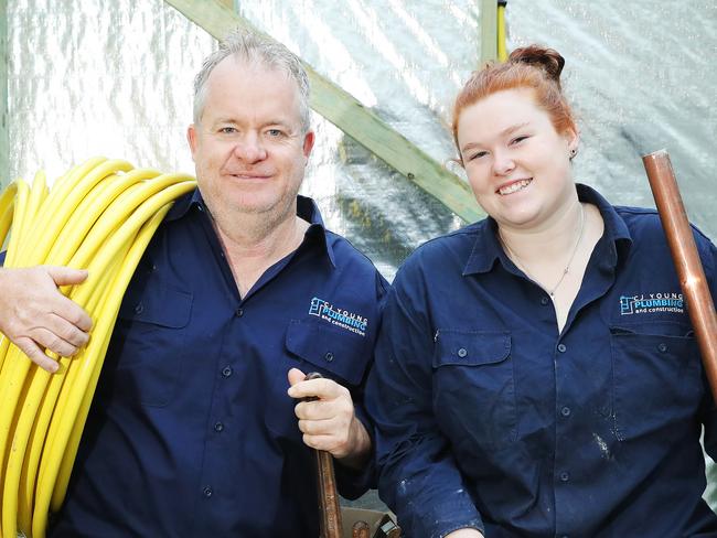 Plumber Colin Young and his apprentice Rebecca Harrison pictured on a house construction site in Peakhurst. Companies are working around the clock to meet a growing demand for home renovations after many families used the lockdown to decide on how to upgrade their home. TAFE NSW says this construction boom will benefit young people looking into industry as a potential career path as well as new apprentices who are about to step into the workforce. Picture Rohan Kelly