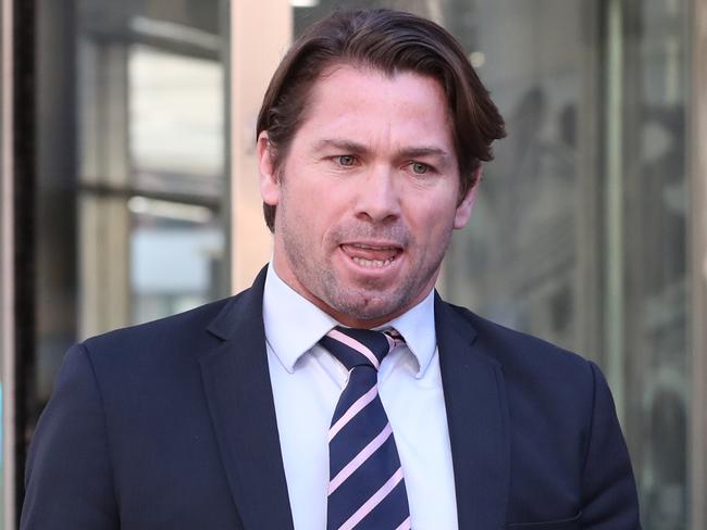 Former AFL player Shannon Grant leaves the Melbourne County Court in Melbourne, Thursday, August 2, 2018. Mr Grant is appealing a six-month jail sentence for assaulting a woman, with his lawyer instead seeking a community corrections order. (AAP Image/David Crosling) NO ARCHIVING