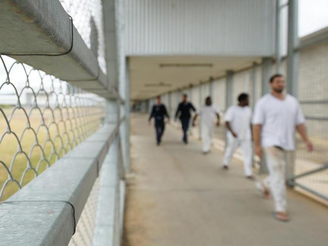 Staff escort prisoners through Queensland; Lotus Glen Correctional Centre. The male prison with a capacity to detain roughly 730 prisoners, over half of whom are Aboriginal and Torres Strait Islander prisoners. Picture: Daniel Soekov for Human Rights Watch