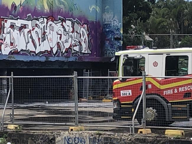 Fire crews in attendance at a suspicious fire under a building on Hockings St, South Brisbane. Picture: Shaye Windsor