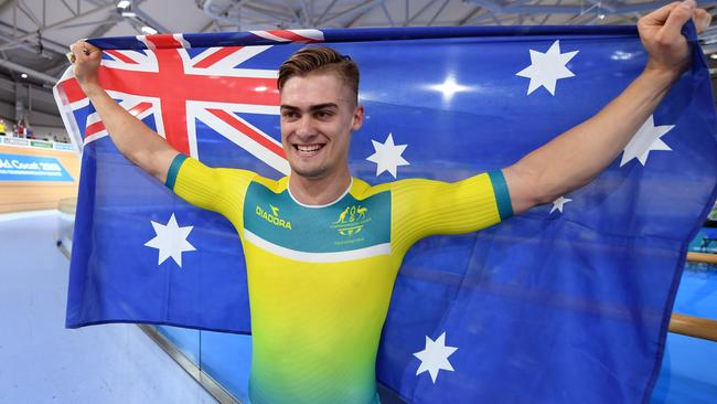 Matthew Glaetzer of Australia gestures to the crowd after winning gold in the Mens 1000m time trial on day four of the track cycling competition at the Anna Meares Velodrome during the XXI Commonwealth Games in Brisbane, Australia, Sunday, April 8, 2018. (AAP Image/Dan Peled) NO ARCHIVING, EDITORIAL USE ONLY