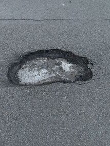 A pothole just before Hexham Macca's heading towards Maitland. Supplied.