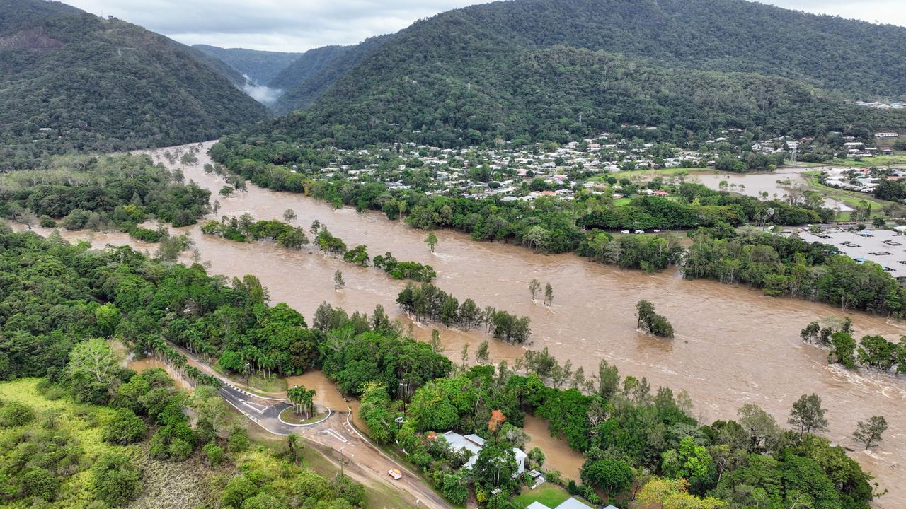 The Barron River in Cairns, Far North Queensland, reached a record flood peak, with roads closed and homes flooded in the catchment area on Sunday, December 17. Flood waters lap at the Kamerunga bridge on the Western Arterial Road, and despite the bridge remaining open, road access was cut to the northern beaches of Cairns. The record flooding was caused by ex Tropical Cyclone Jasper, which made landfall on December 13. Picture: Brendan Radke