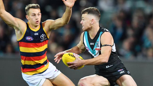 Robbie Gray breaks clear of Adelaide’s Tom Doedee during the Power’s thrilling Showdown 44 win. Picture: David Mariuz (AAP).