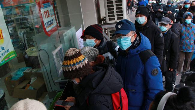 People queue to buy medicine at a pharmacy amid the Covid-19 pandemic in Nanjing, in China's eastern Jiangsu province on December 20. Picture: AFP