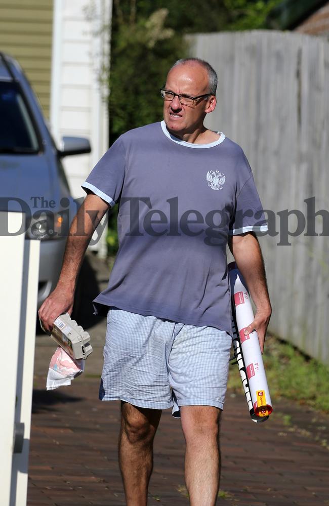 Luke Foley carries a used nappy, empty egg carton and what appeared to be a leadership poster which he tossed in the trash. Picture: John Grainger