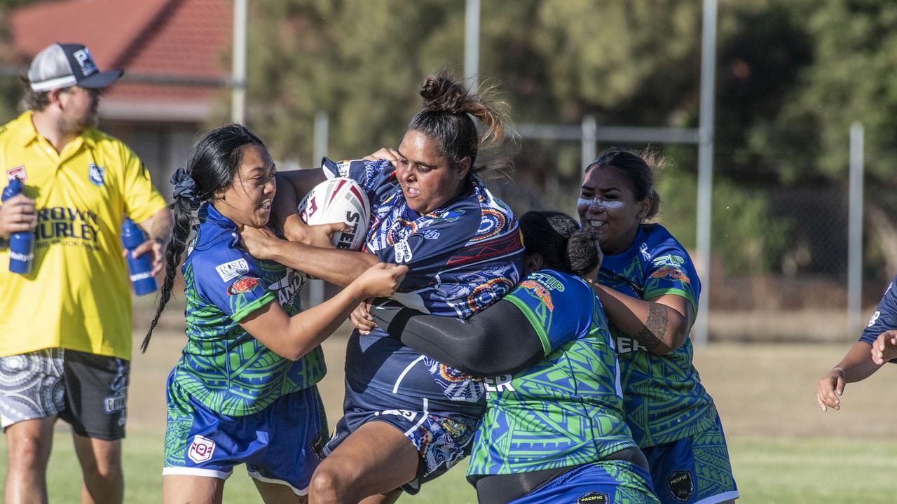 Southwest Queensland Emus Tegan Gibbs is wrapped up in a tackle during the 2023 TRL Cultural Cup clash against the Pacific Nations. Picture: Nev Madsen.