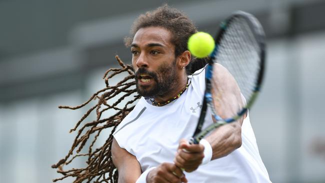 Germany's Dustin Brown says coronavirus would have ruined his career when he started out. / AFP PHOTO / Glyn KIRK