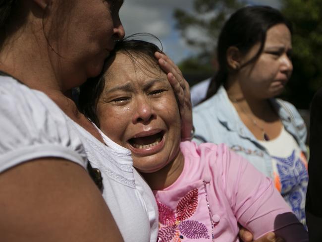 Shocked ... May Thein, the mother of Win Zaw Htun, is overcome with emotion after his guilty verdict. Picture: AP Photo/Wason Wanichakorn