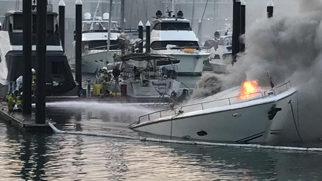 A yacht sinks into Hamilton Island Marina on the evening of October 24. Picture: VMR Whitsundays