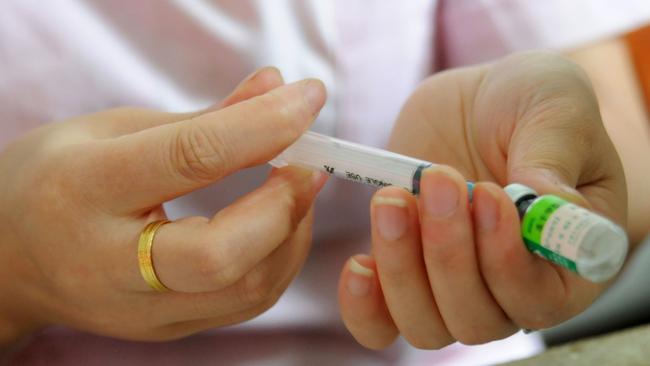 Preparing a vaccination shot. Picture: AFP