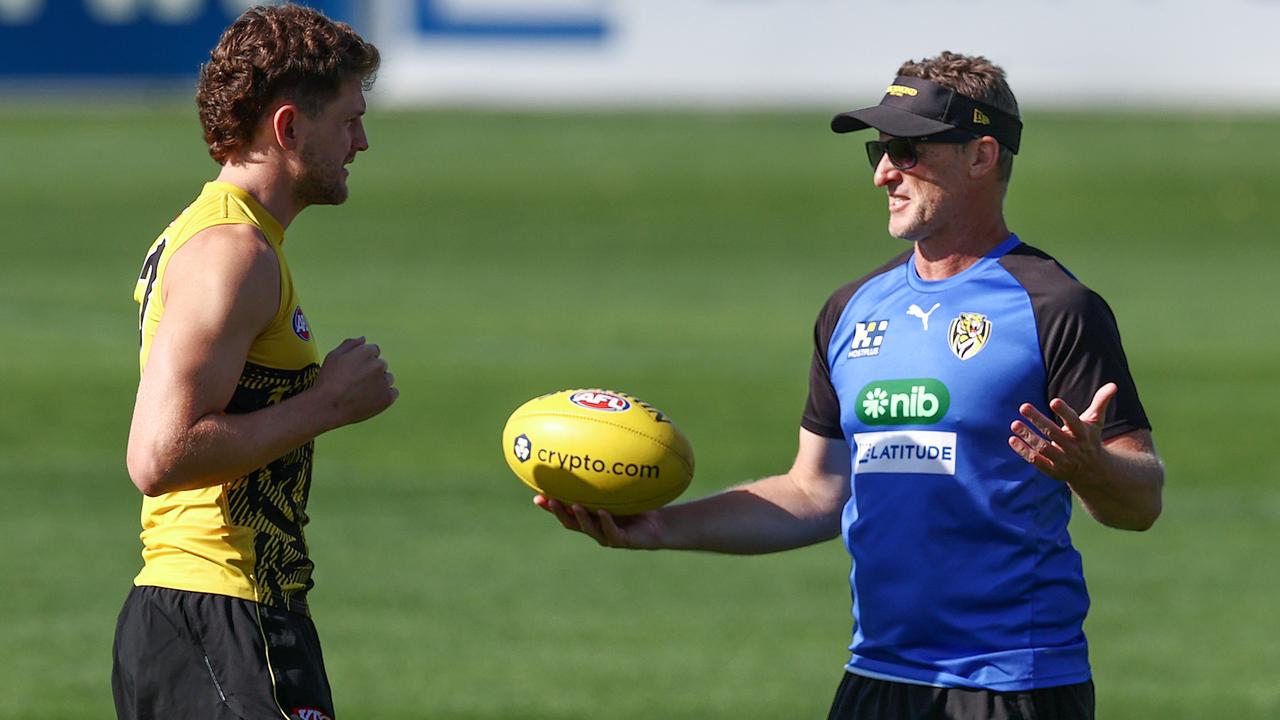 Tigers coach Damien Hardwick chats with Jacob Hopper during training. Pic: Michael Klein