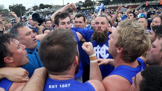 Hastings players sing the club song after upsetting Frankston Bombers. Picture: Mark Dadswell