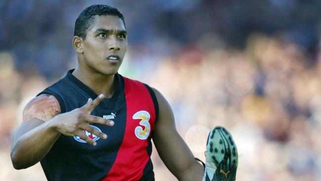 Damian Cupido gets a kick away on ANZAC Day in 2003.