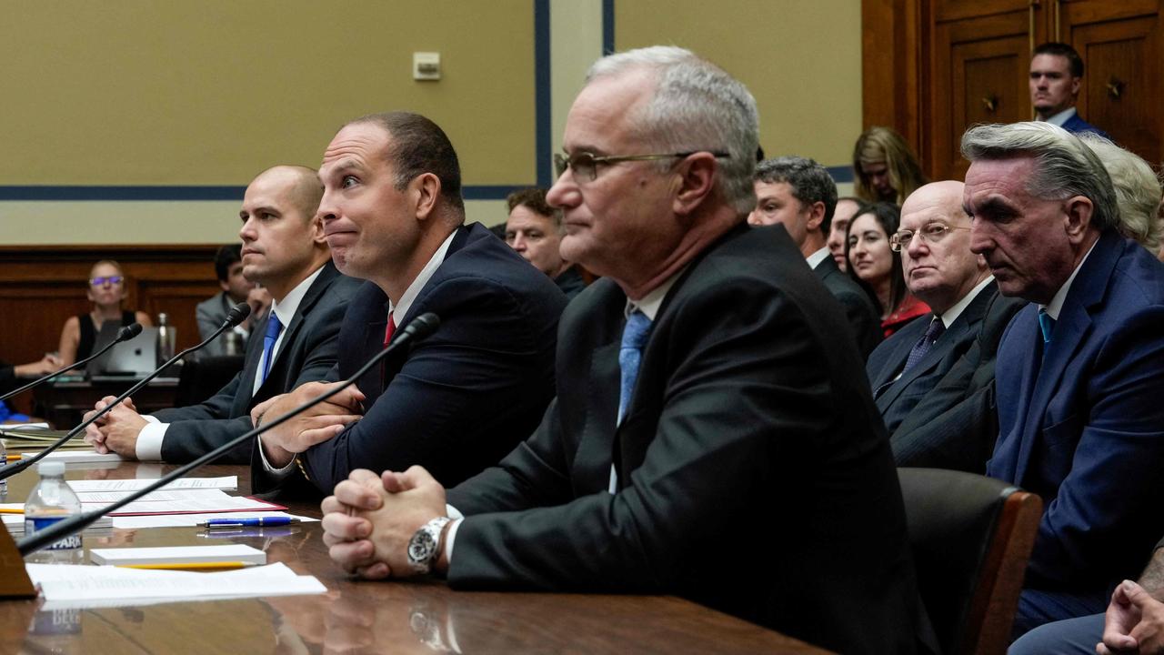 Mr Grusch (middle, red tie) testified alongside Americans for Safe Aerospace executive director Ryan Graves (left), and Retired Navy Commander David Fravor (right). Picture: Drew Angerer/Getty Images North America/AFP.