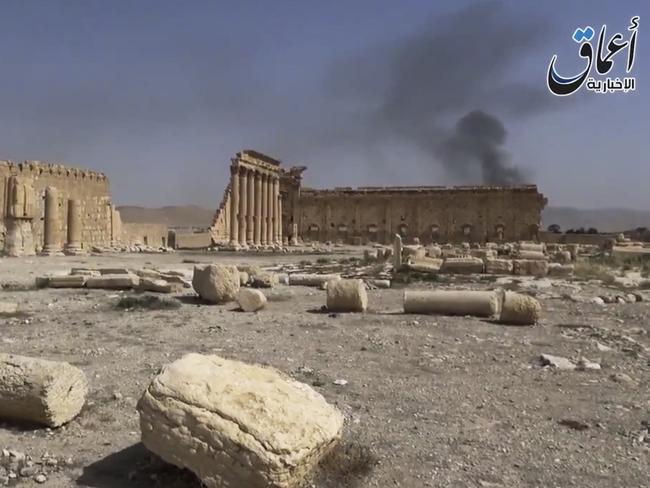 Delicate remains ... Smoke rises behind archaeological ruins in Palmyra, Syria. The video released by a media arm of the Islamic State group purportedly showed the archaeological ruins of Palmyra apparently undamaged. Source: AP