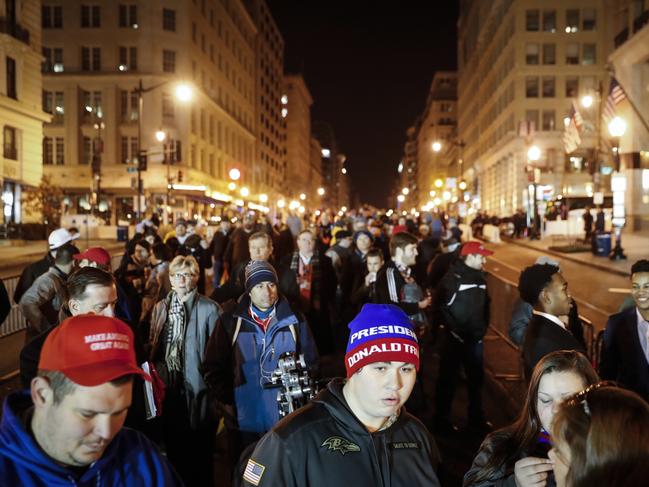 Spectators wait in line to pass through security checkpoints for the inauguration. Picture: AP