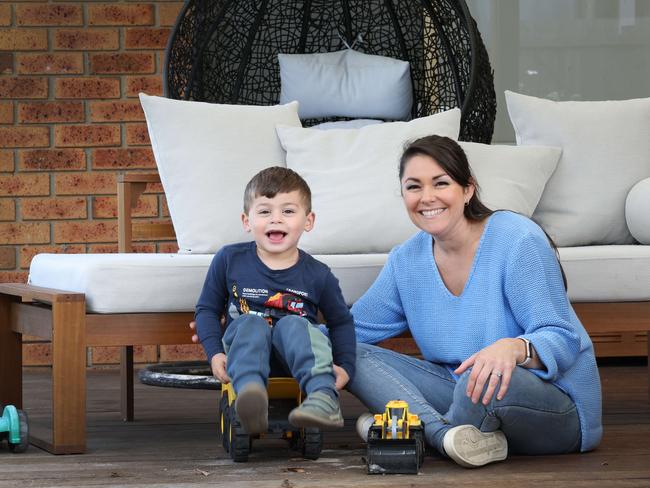 Natalie Flores with her three-year-old son Rafael, elected to care for her own children due to the costs of childcare. Picture: Andrew Tauber