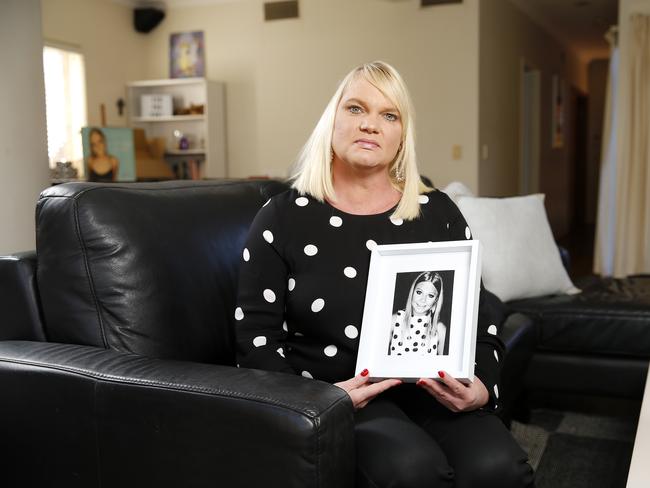 Kirsten McGinty with a photo of Zoe at her home in Clayfield. “Not a day goes by when I don’t miss Zoe”. Picture: Josh Woning