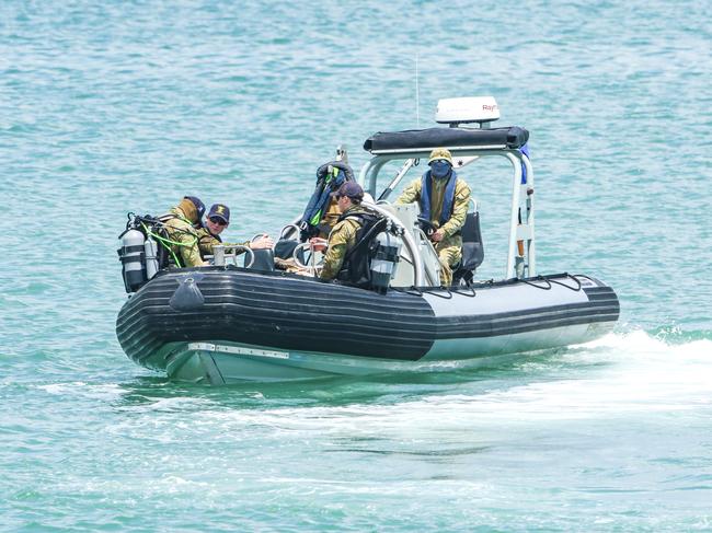 ADF divers work on recovering a World War 2 era UXO from Darwin Harbour at the site of the proposed ship lift.Picture: Glenn Campbell