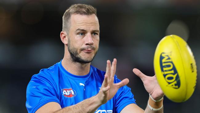 BRISBANE, AUSTRALIA - APRIL 02: Josh Walker of the Kangaroos warms up during the 2022 AFL Round 03 match between the Brisbane Lions and the North Melbourne Kangaroos at The Gabba on April 02, 2022 In Brisbane, Australia. (Photo by Russell Freeman/AFL Photos via Getty Images)