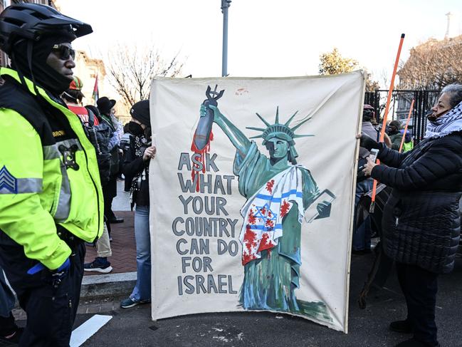 People protest the visit of Israeli Prime Minister Benjamin Netanyahu in the US holding flags and various banners in the streets of Washington. Picture: Getty Images