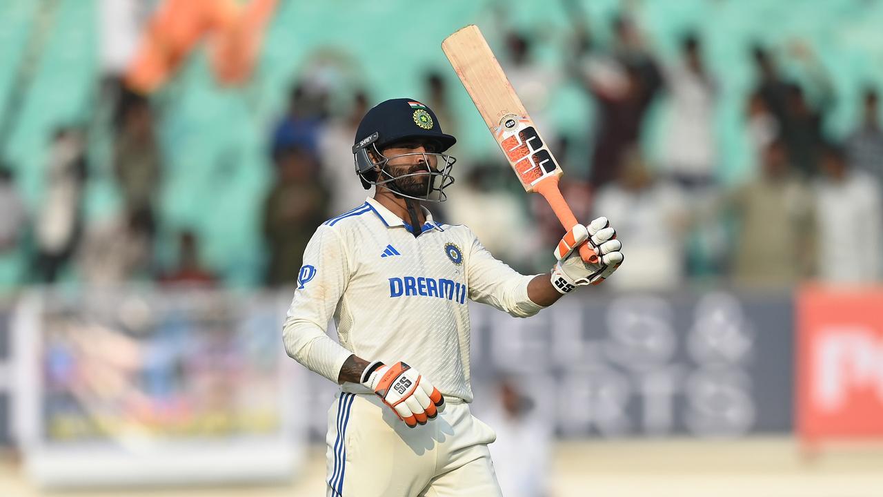 Jadeja celebrates his century. (Photo by Gareth Copley/Getty Images)