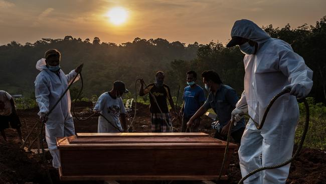 A burial underway at the Jatisari public cemetery, reserved for suspected COVID-19 victims in Semarang, Central Java. Picture: Getty Images