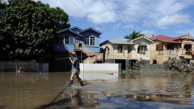 Devastated residents of Torwood Street in Milton returned to continue the clean up only to find their houses almost knee deep in water again due to the high tide on Sunday, January 16, 2011.