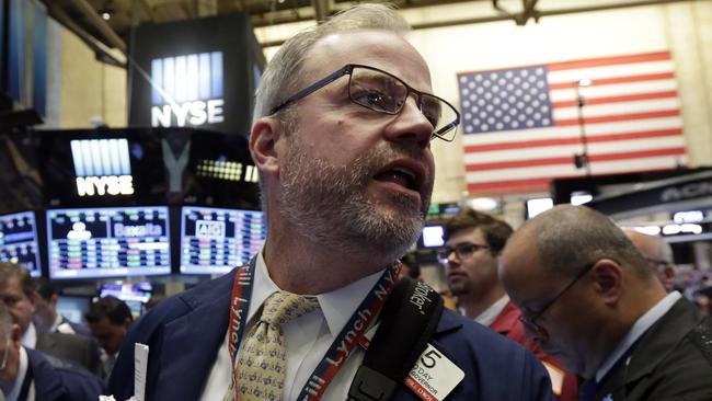 Trader David O'Day works on the floor of the New York Stock Exchange Thursday, Aug. 6, 2015. U.S. stocks edged modestly lower in early trading as investors look over the latest deal and earnings news. Sliding oil prices pulled stocks in energy companies lower. (AP Photo/Richard Drew)