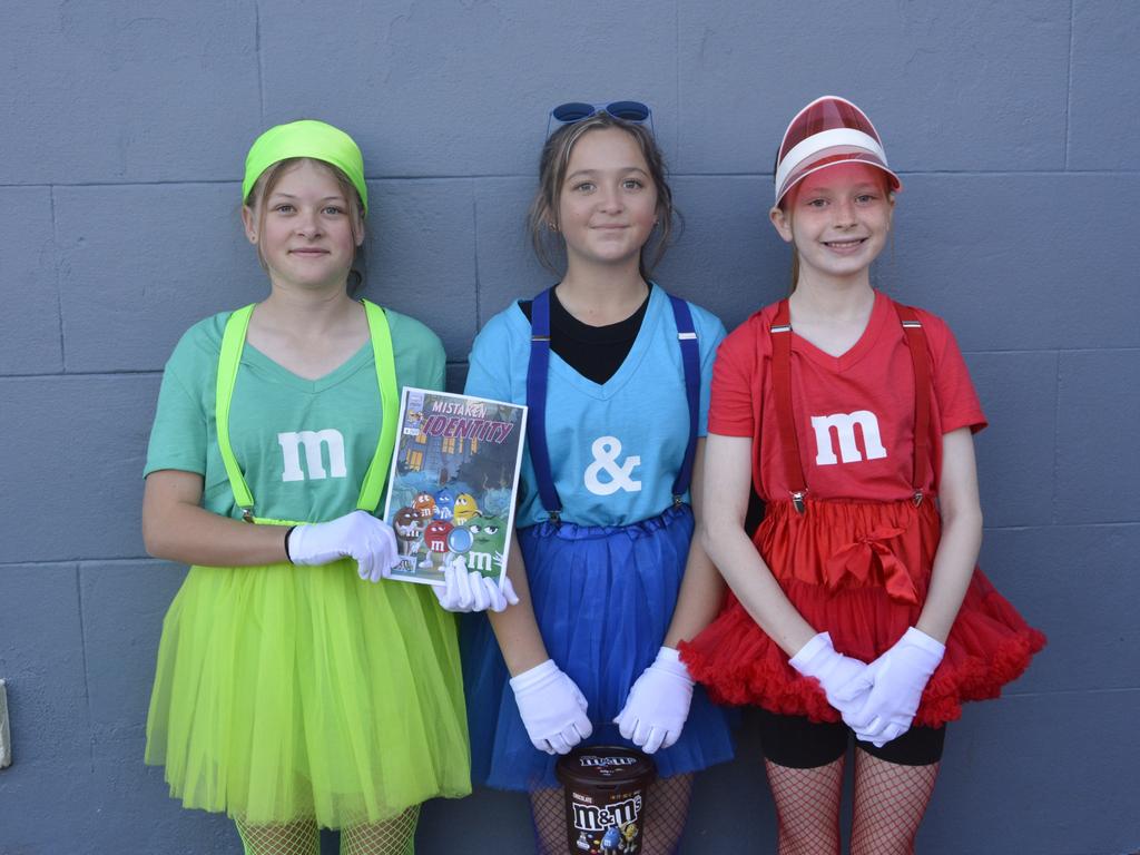 Dressed as chocolate M &amp; M's are (from left) Ellie Sharpe, Bianca Bugg and Freya Doherty. Picture: Rhylea Millar