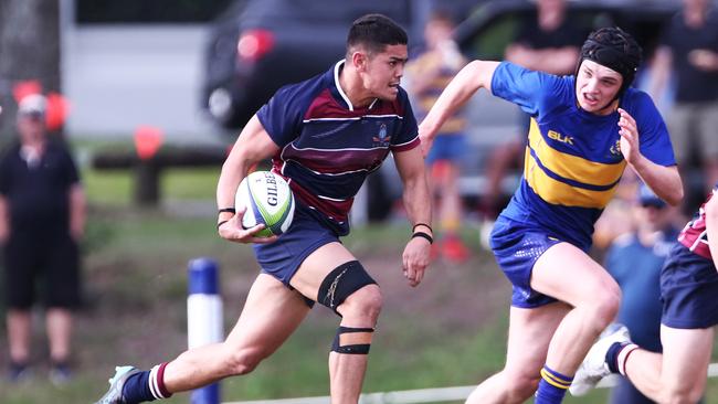 Kaleb Ngamanu of TSS in action against Toowoomba Grammar during their GPS Rugby Union match at Southport on the Gold Coast. Photograph : Jason O'Brien