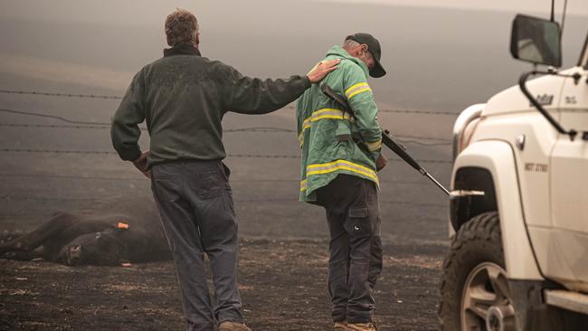 Bill lays a comforting hand on his brother’s shoulder. Picture: Jason Edwards