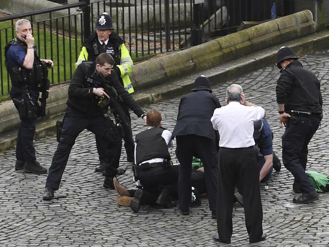 The attacker jumped out of his car and ran into the New Palace Yard and stabbed a policeman before being shot. Picture: AP