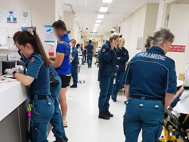 Paramedics wait with patients in a hallway at the PA Hospital in one of the whistleblower photos.