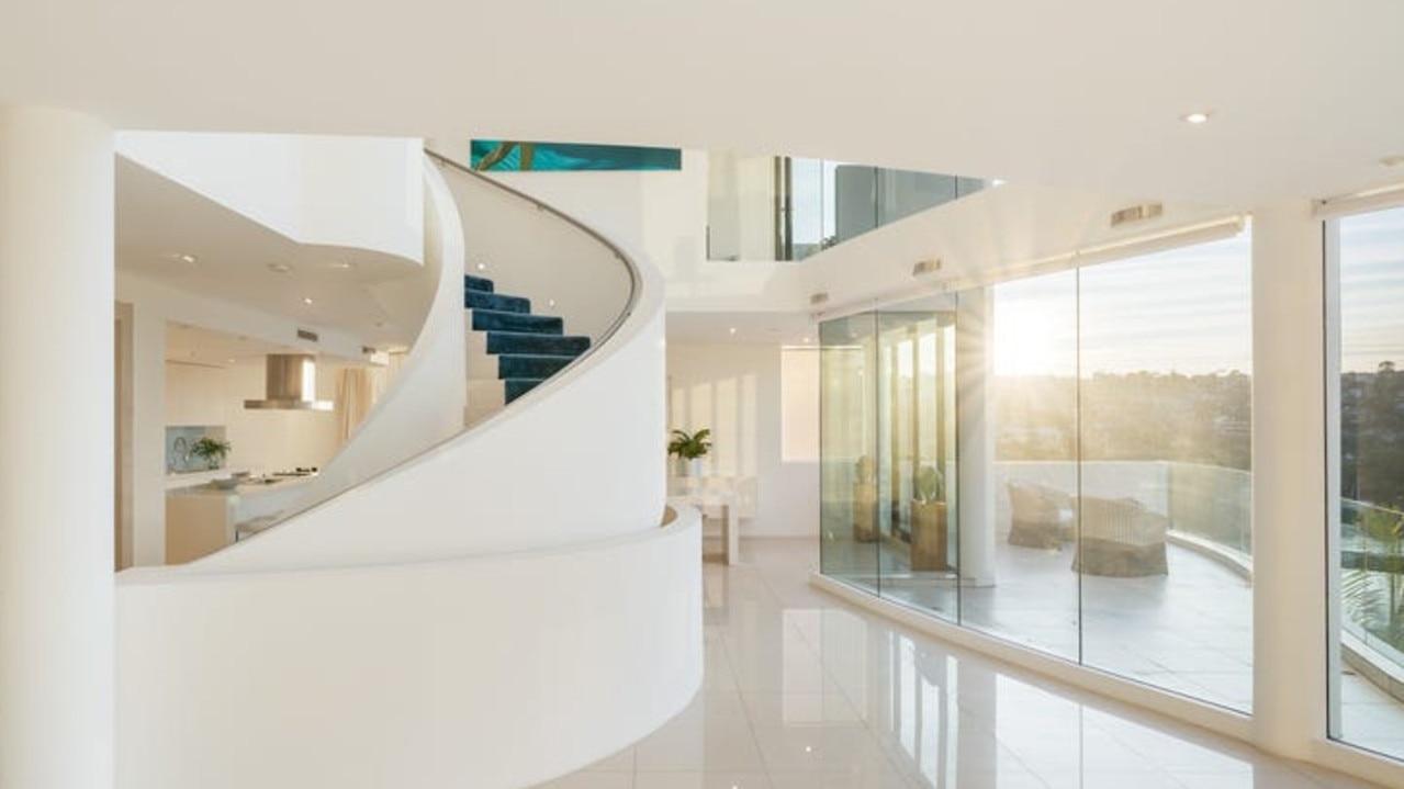 It’s defined by signature curves, features a striking sculptural staircase.