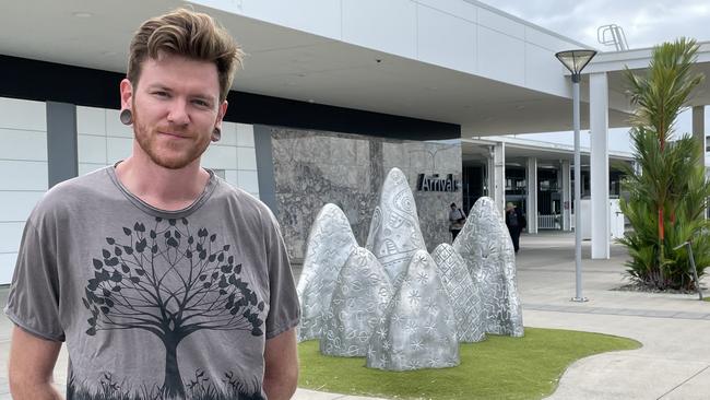 Kyle Lloyd, who arrived at Cairns airport from Brisbane and has recently travelled internationally, supports a stepped mask strategy wherein airlines set the rules according to Covid transmission rates going forward. Photo: Isaac McCarthy.