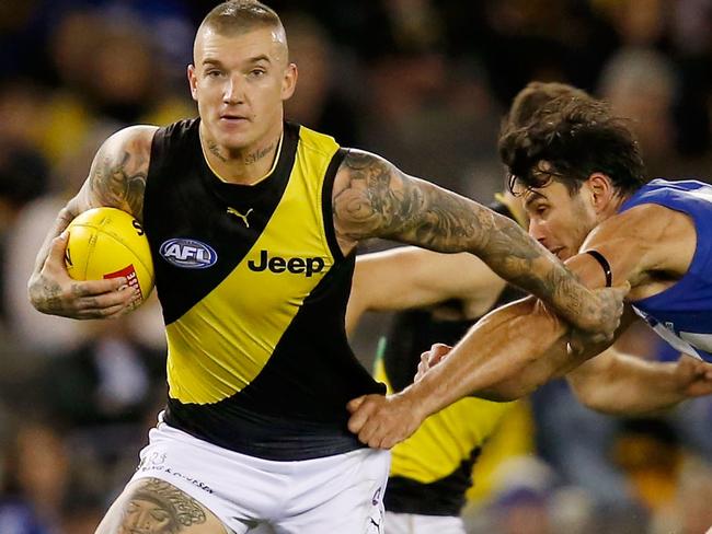 MELBOURNE, VICTORIA - MAY 13:  Dustin Martin of the Tigers runs with the ball during the round eight AFL match between the North Melbourne Kangaroos and the Richmond Tigers at Etihad Stadium on May 13, 2018 in Melbourne, Australia.  (Photo by Darrian Traynor/AFL Media/Getty Images)