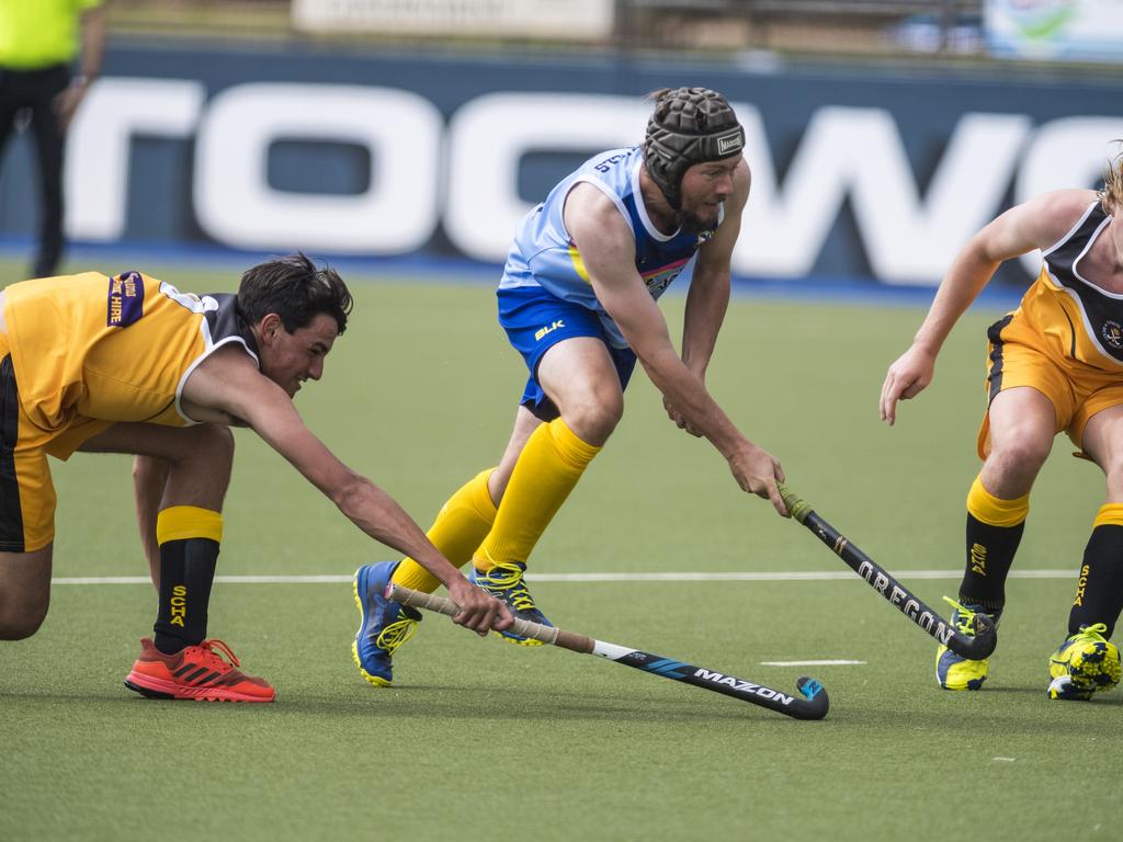 Lachlan Brownhalls (centre) of Toowoomba 1 against Sunshine Coast in Hockey Queensland Championships at Clyde Park, Sunday, May 2, 2021. Picture: Kevin Farmer