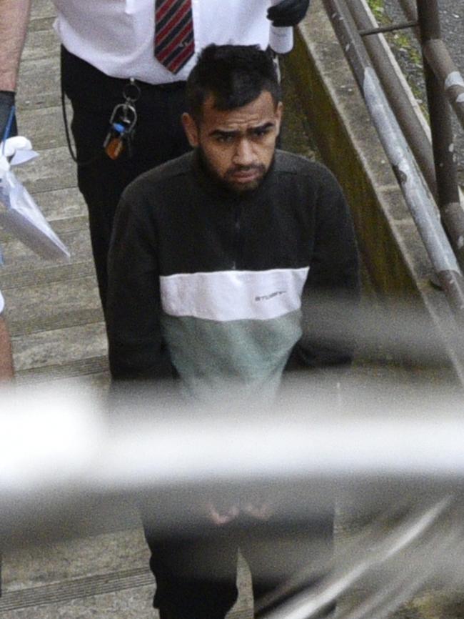 Lyle Morrison, 18, is escorted by court security out of the Adelaide Magistrates court.  Picture: AAP/David Mariuz